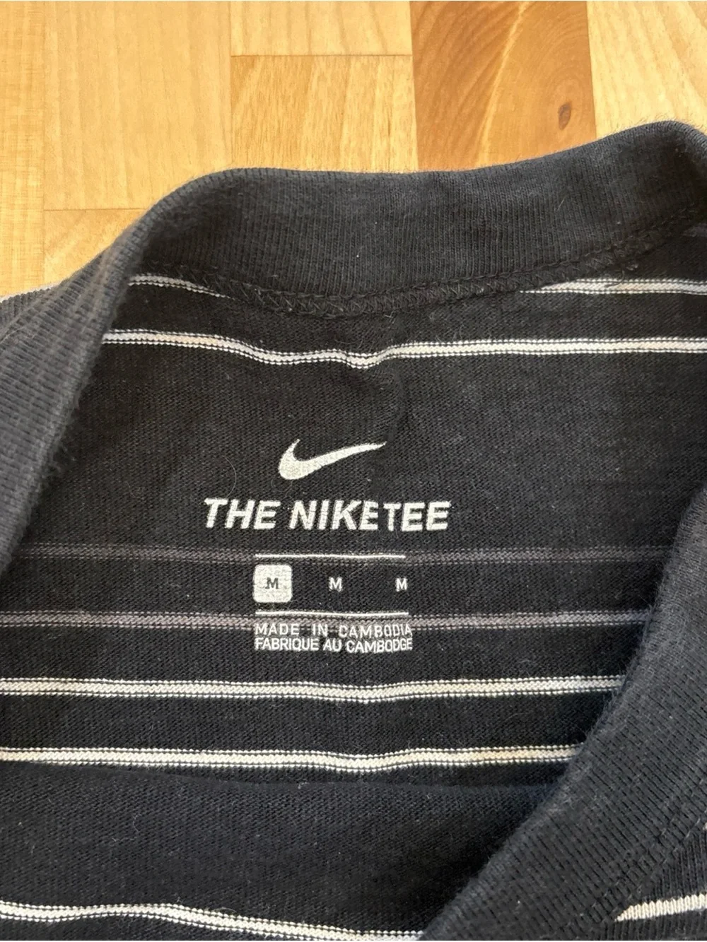 Nike Men’s Black Tee with White Stripes and Embroidered Logo